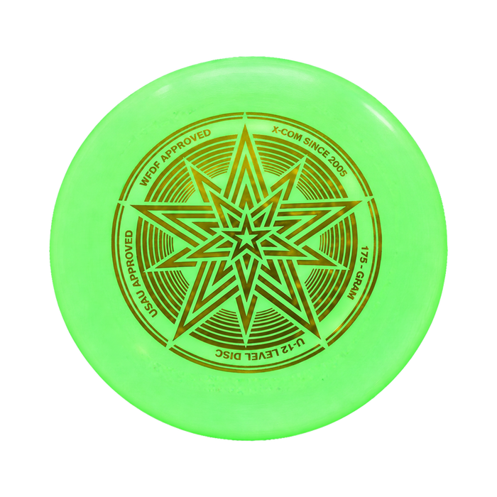XCOM Ultimate Star Glow disc glowing green in dark surroundings after charging